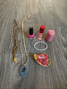 Mixture of jewelry, makeup, and decorated oyster shell